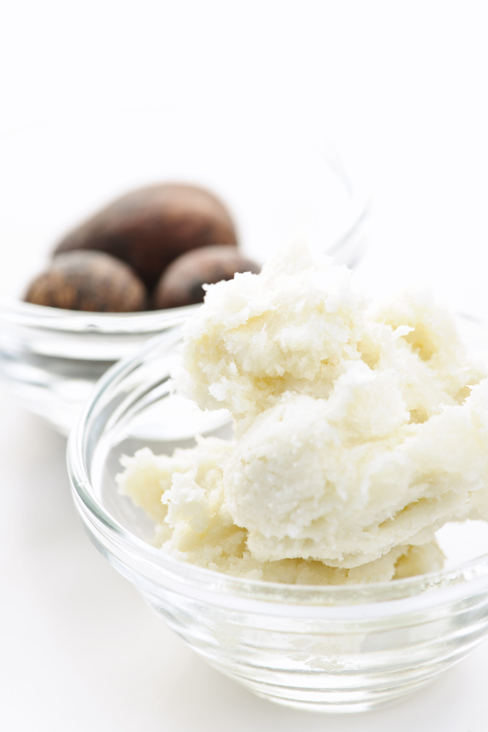 Shea butter and nuts in bowls